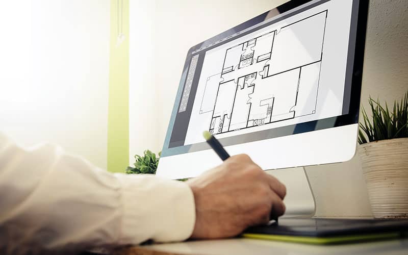 Pharmacy designer working on computer