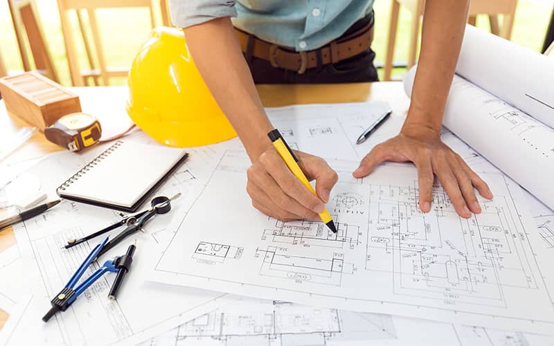 Builder working from plans