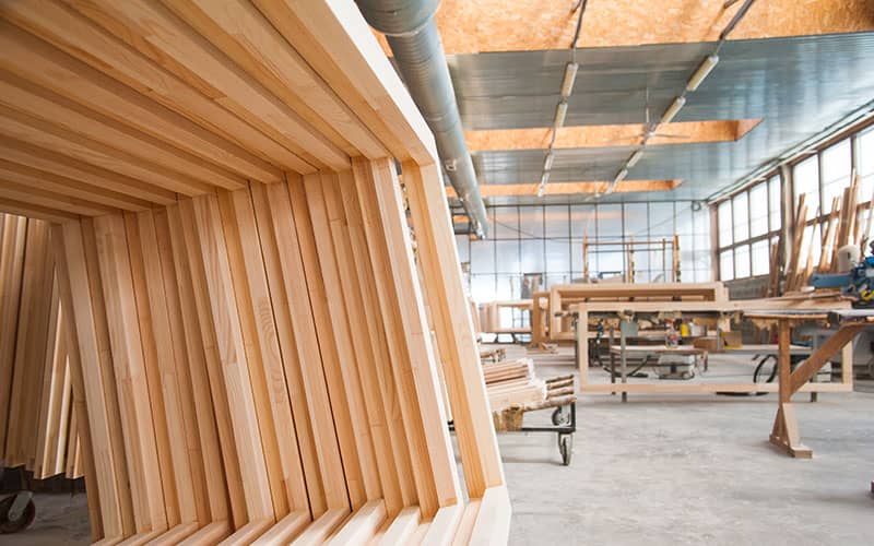 Stacks of wooden frames in warehouse